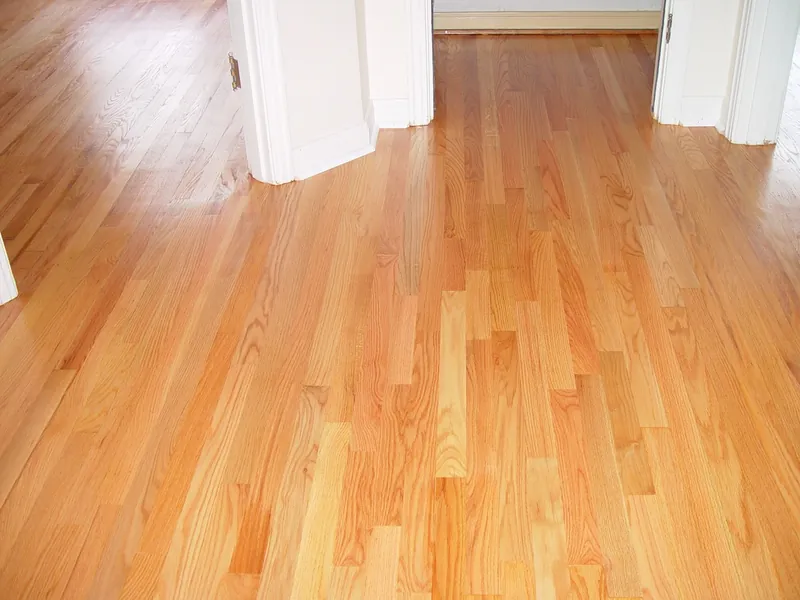 Refinished oak hallway with clearer grain and a more even appearance